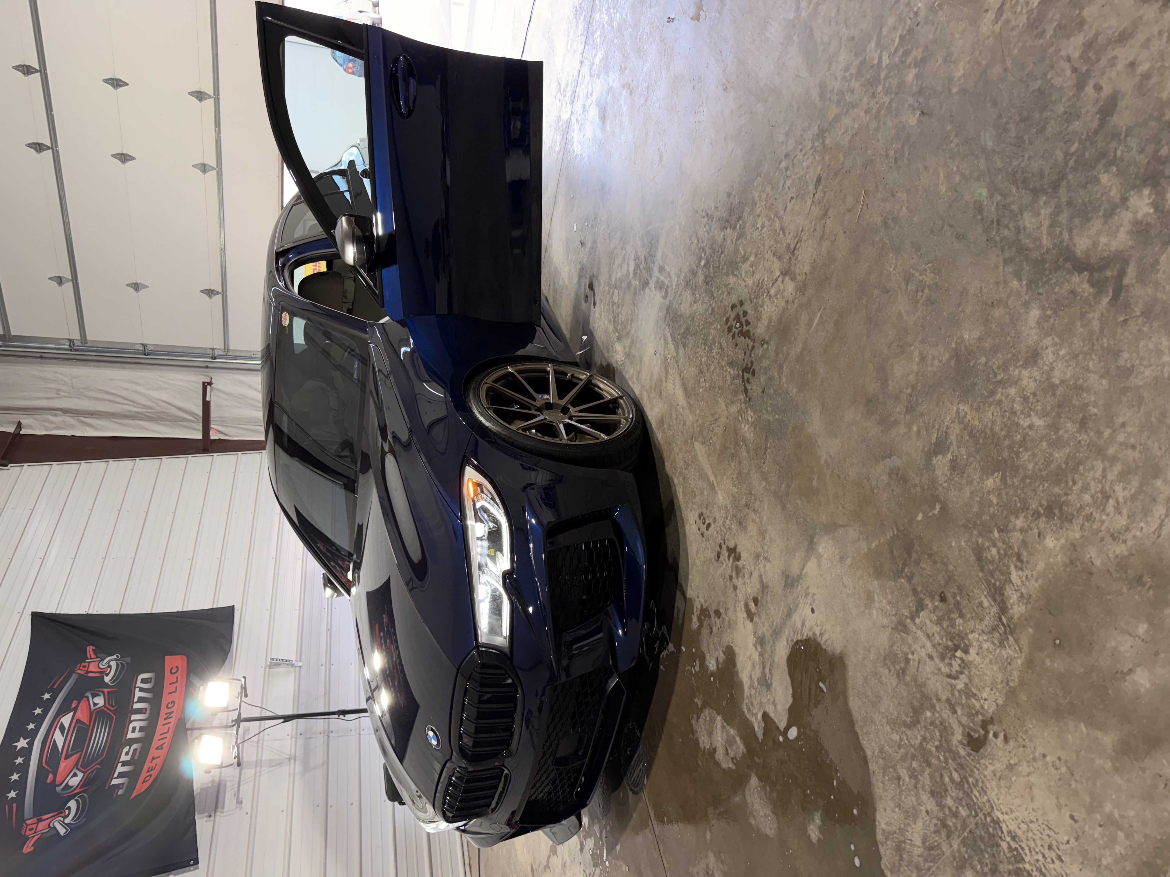 A freshly detailed BMW M340i at the JTS Auto Detailing shop
